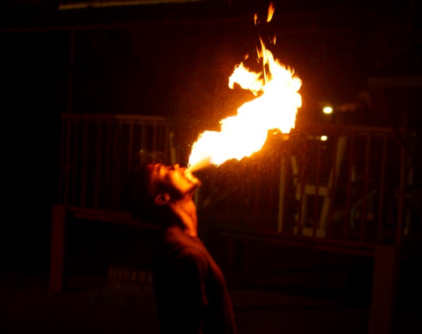 Moswatii performing a live fire-breathing act
